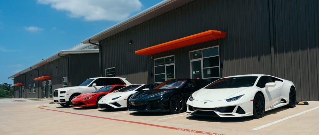 Some of Luxe AF Motors' exotic rental cars are parked outside the warehouse in Spring. (Photo courtesy Luxe AF Motors) 