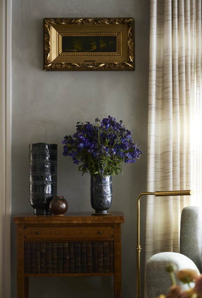 Antique table from Round Top and MOUS vase, left. Harvey Joiner landscape painting. (Photo by Kristopher Ellis)
