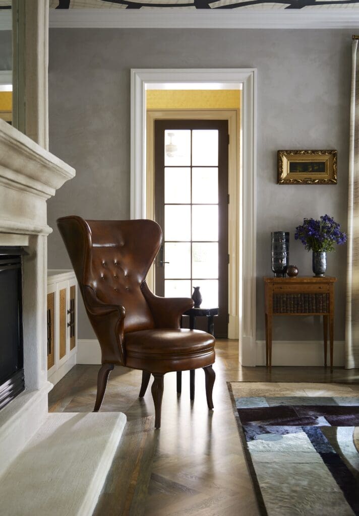 Leather wingback chair from Jean de Merry. Plaster wall finish by Chateau Domingue. (Photo by Kristopher Ellis)