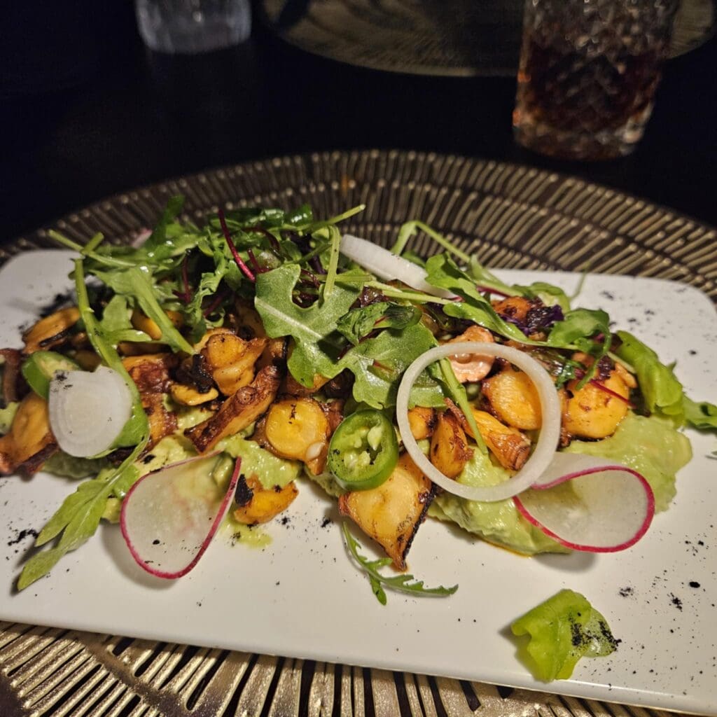The Chicharrón Azteca at Polanco features grilled octopus with avocado mash, macha sauce, citrus, and fresh toppings. (Photo by Edward Brown)