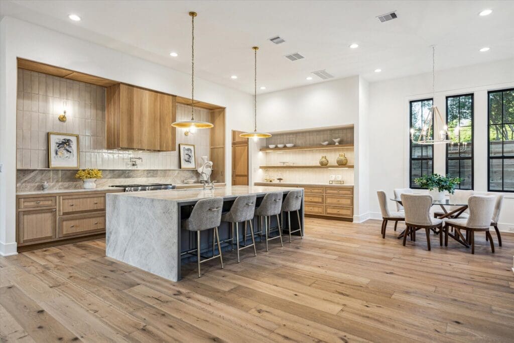 The state-of-the-art kitchen opens to the family room (Photo by TK Images)