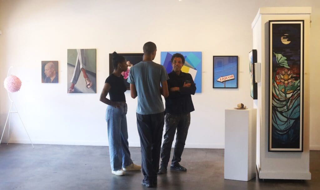 Rick Lowe (far right) pictured with his assistants at Archway Gallery while he evaluated artworks featured in the gallery's 17th Annual Juried Exhibition,on view through July 31, 2025. (Courtesy Archway Gallery, Houston)