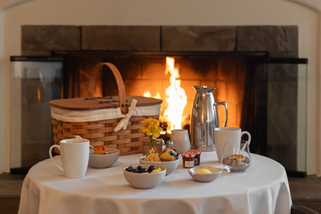 Guests of Casa Palmero enjoy a complimentary wellness breakfast fireside, with fresh juices, overnight oats, and flaky pastries delivered to your door.