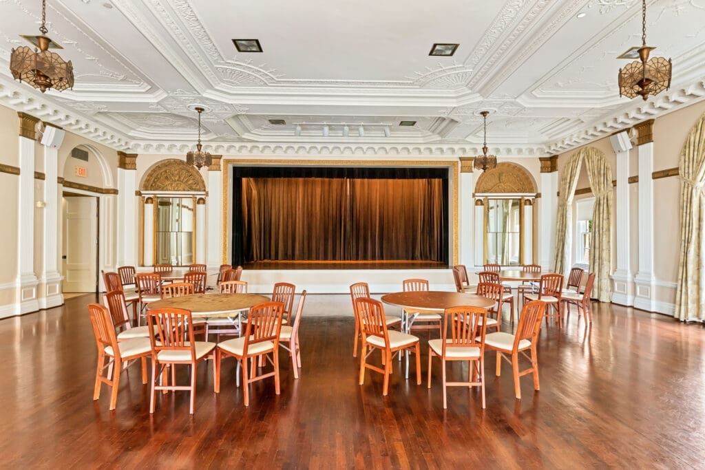 The ornate second-floor theater, part of the building’s 1928 design, will be modernized with new technology for events. (Courtesy LanCarte Commercial)