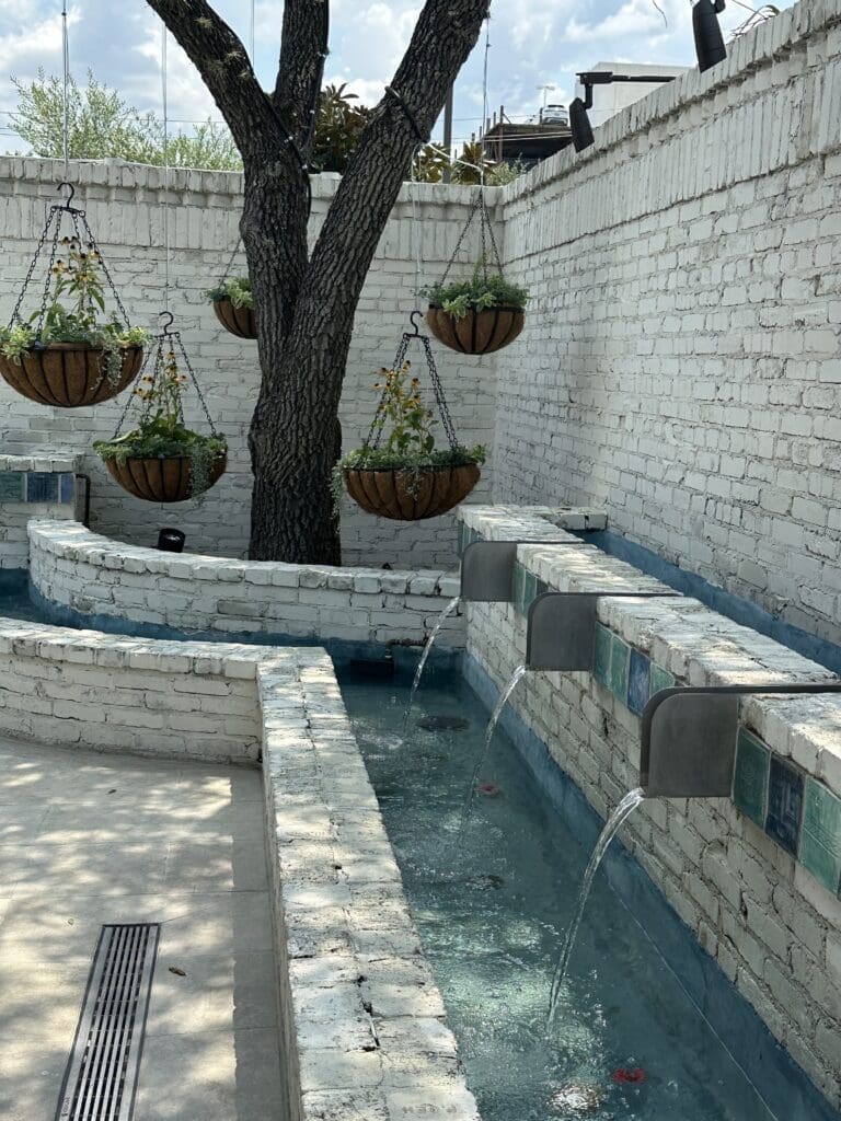 The outdoor dining area at Yiayia's Greek Kitchen is flanked by a girgling water feature. (Photo by Shelby Hodge)