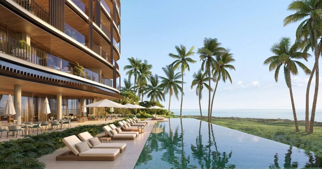 Poolside at Mandarin Oriental's Ocean House residences offers cliffside views to the clear waters of Grand Cayman. 
