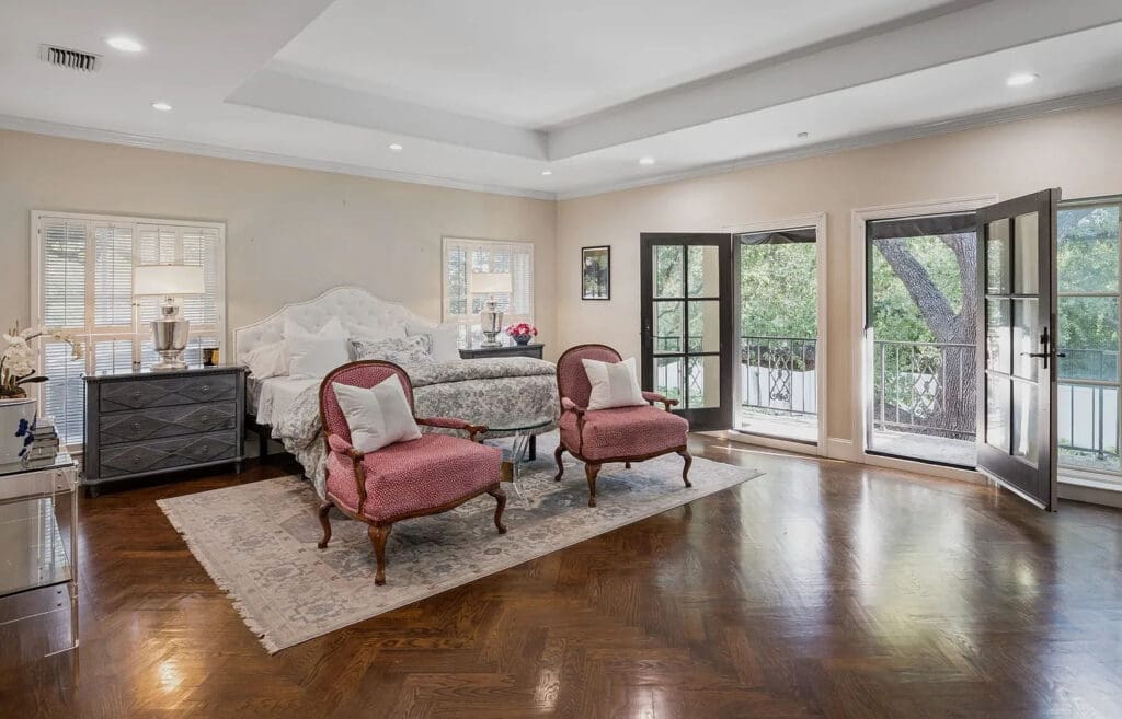 The primary retreat, which is mirrored by a separate mother-in-law suite, spoils its owners with terraces overlooking the backyard. (Photo by Allie Beth Allman & Associates)