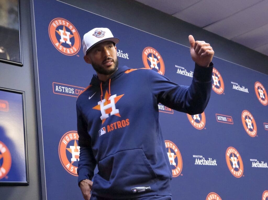 Carlos Correa is all thumbs up on his return to the Astros, living in Houston again and being back with Jose Altuve. (Photo by F. Carter Smith)