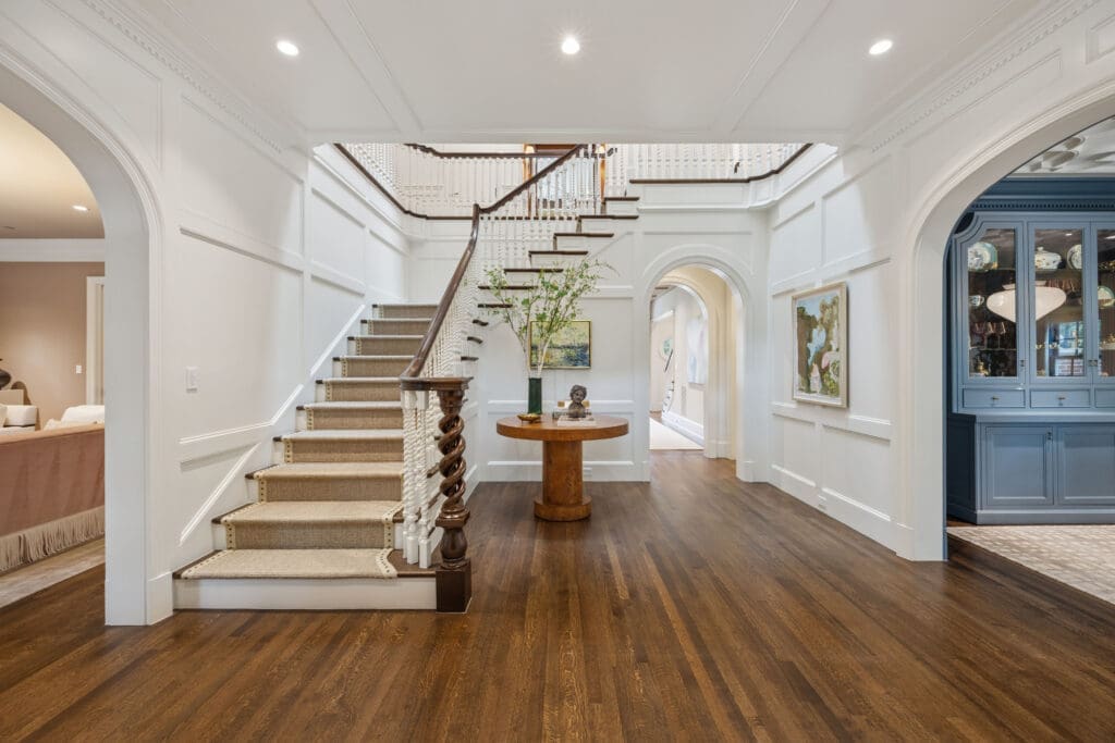 A formal living room and dining room flank the entry. (Photo by Full Package Media / Compass)