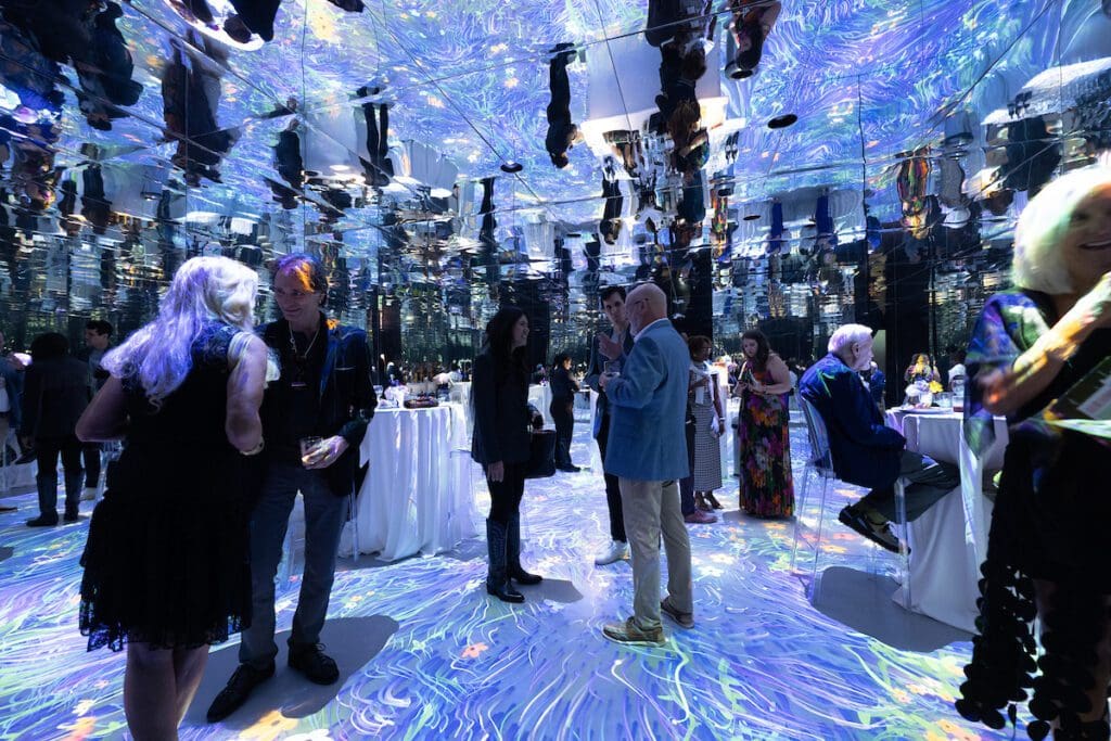 ROCO gala guests peruse the Artechouse Houston AI exhibit. (Photo by Daniel Ortiz)