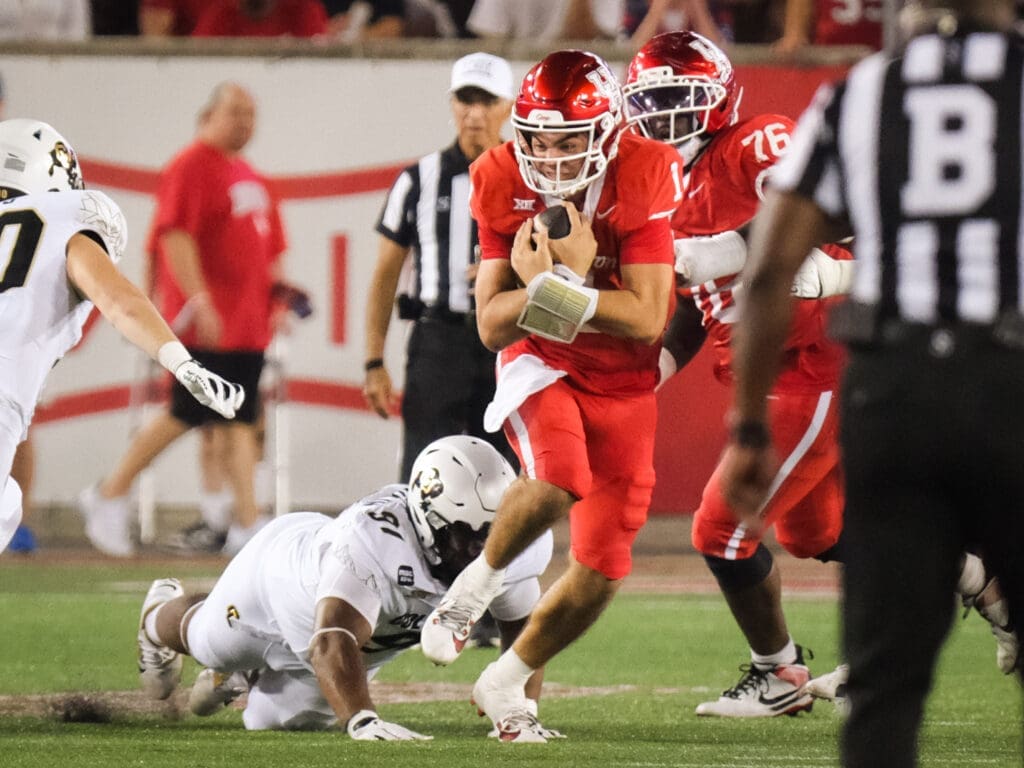 University of Houston players fight for extra yards under Willie Fritz. (Photo by F. Carter Smith)