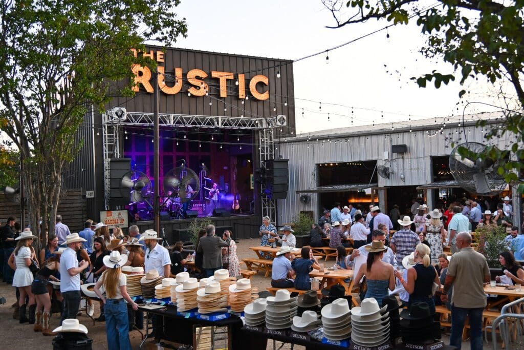 The evening included all the hits— classic Midway games (minus the steep price per game!) under the open sky, a caricature artist, an interactive branding station, and a popular cowboy hat and boot bar. (Photo by State Fair of Texas)