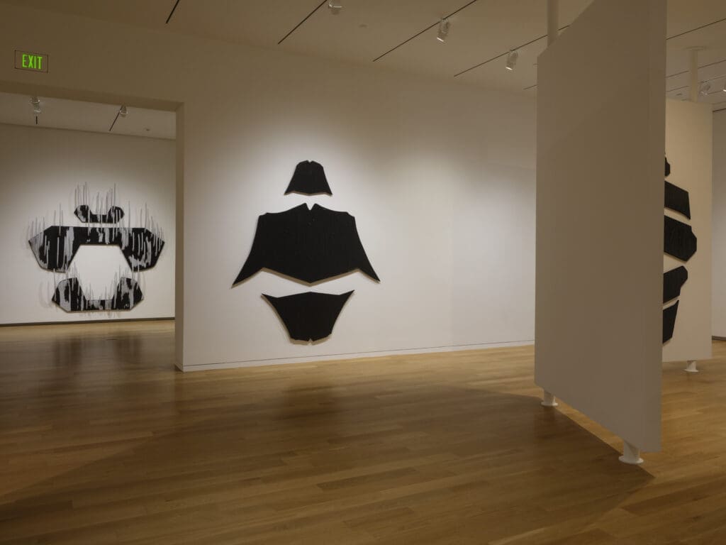 Black triptychs rise across the gallery walls at the Modern Art Museum of Fort Worth, encircling viewers in David-Jeremiah’s monumental series. (Photo by The Modern Art Museum of Fort Worth )