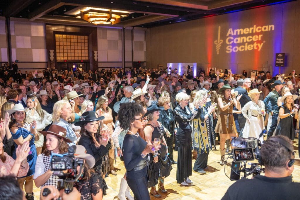 A roaring Heads or Tails competition at the Houston Cattle Baron's Ball. (Photo by Jacob Power)