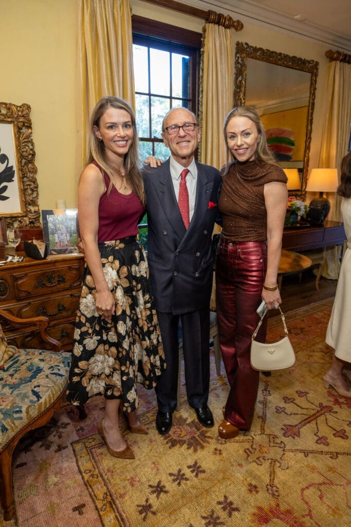 Brittan Sakowitz Kushner and Lexi Sakowitz Marek with their father, Robert Sakowitz, at the Lynn Wyatt book party (Photo by Jenny Antill)