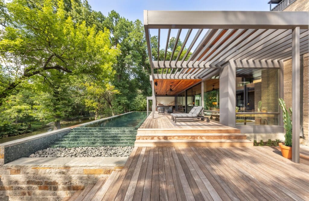 At North Janmar Drive, a natural slope to a creek requires the back of the home and pool to be elevated. (Photo by Terri Glanger)