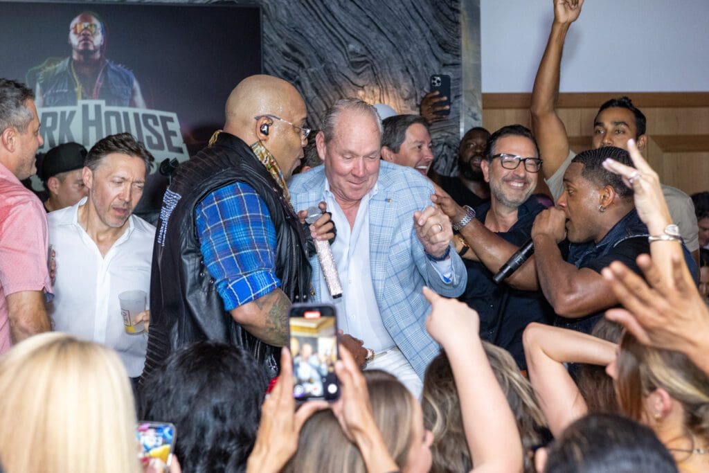 Flo Rida shares a moment with Jim Crane at Park House's Members Welcome Back Party. (Photo by Jacob Power)
