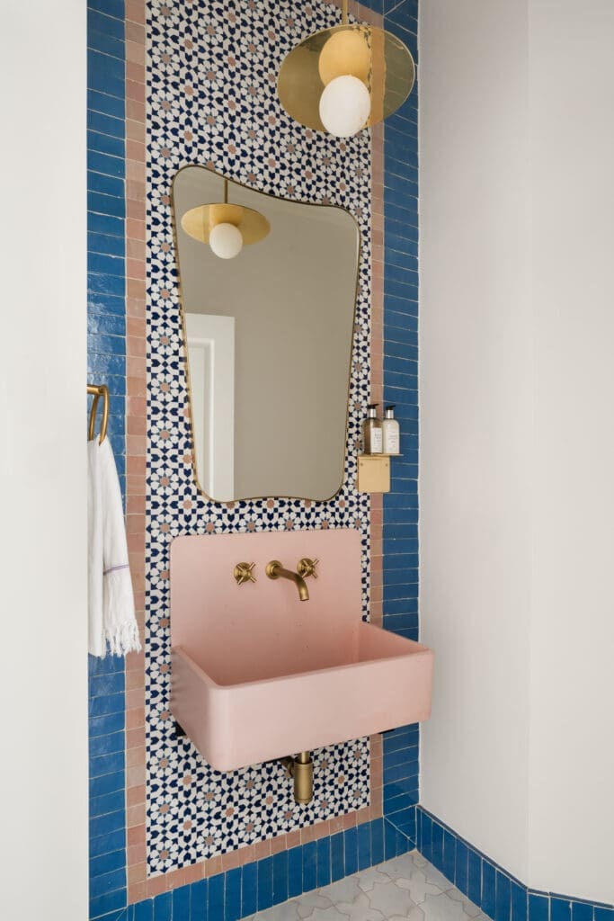 Customized Tiles of Ezra designs add a pop of pink to this powder bath.