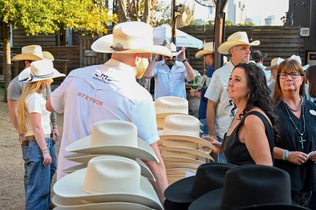 Tammy Stiffler, Patty Poe look at Stetson hats (Photo by State Fair of Texas)