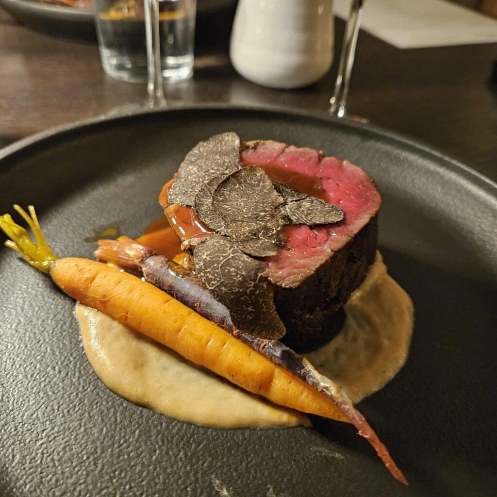 The prime beef filet, layered with truffle and Italian lardo, was served as one of the highlights of Chef Tony France’s six-course Massolino wine dinner at Farena. (Photo by Edward Brown)