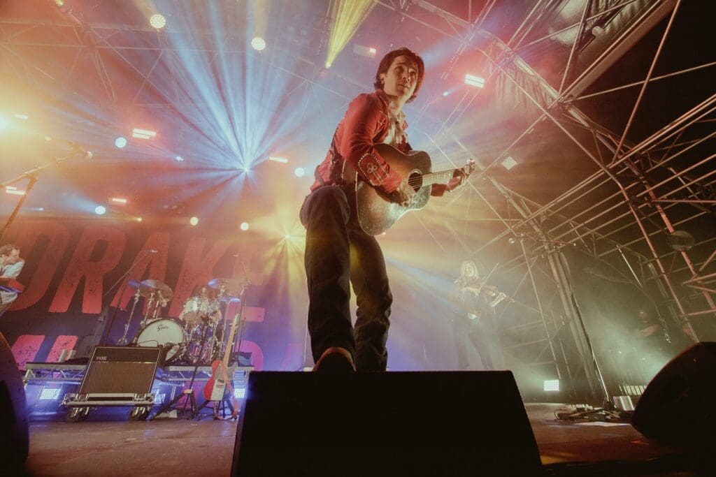 In April, Drake Milligan launched a global tour spanning about 40 shows across North America and Europe, including festival appearances, headlining dates, and performances with stars like Lainey Wilson and Luke Bryan. (Courtesy)

