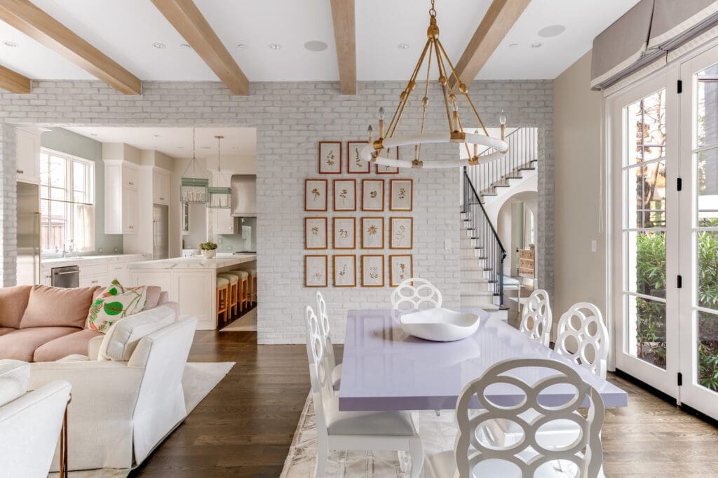 The English farmhouse-style is elevated with unique light fixtures, designer finishes, and cheerful pops of color, 