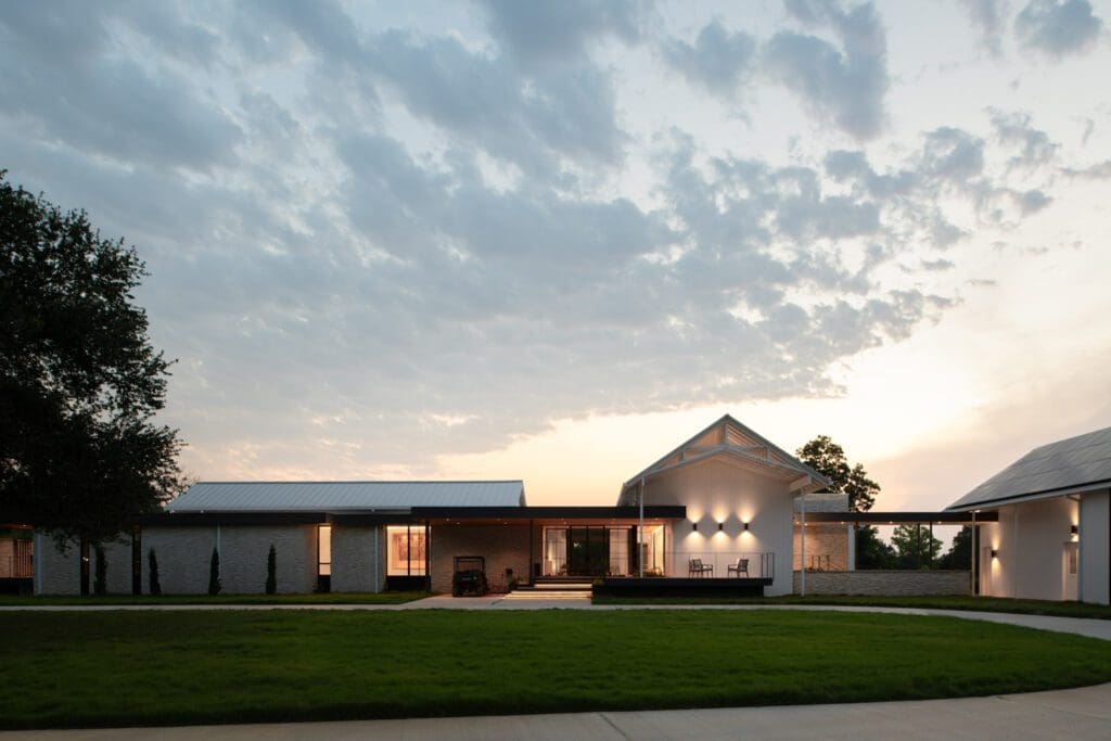 This modern farmhouse harmoniously blends contemporary design with the familiar language of vernacular Texas structures, creating a home that feels both fresh and rooted in place.