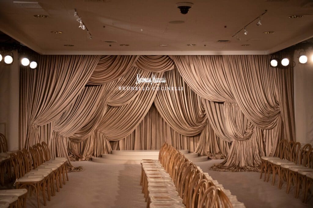 Brunello Cucinelli's sense of Italian refinement brushed all aspects of the event, from the cascading taupe draperies at the runway's entrance to the luncheon's menu. (Photo by Tamytha Cameron)