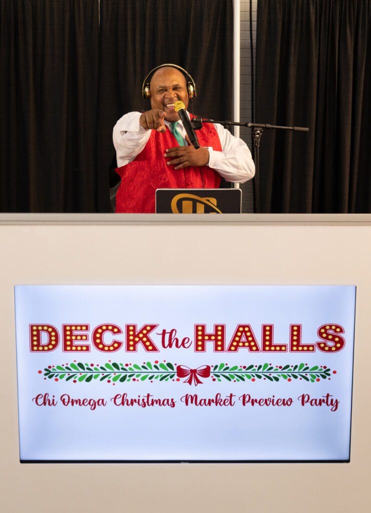 DJ LC gets shoppers to "mix and mingle." (Photo by George Fiala)