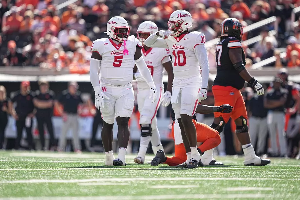 Carlos Allen (No. 5) and Latreveon McCutchin (No. 10) help power Austin Armstrong's University of Houston defense. (Courtesy UH Athletics)
