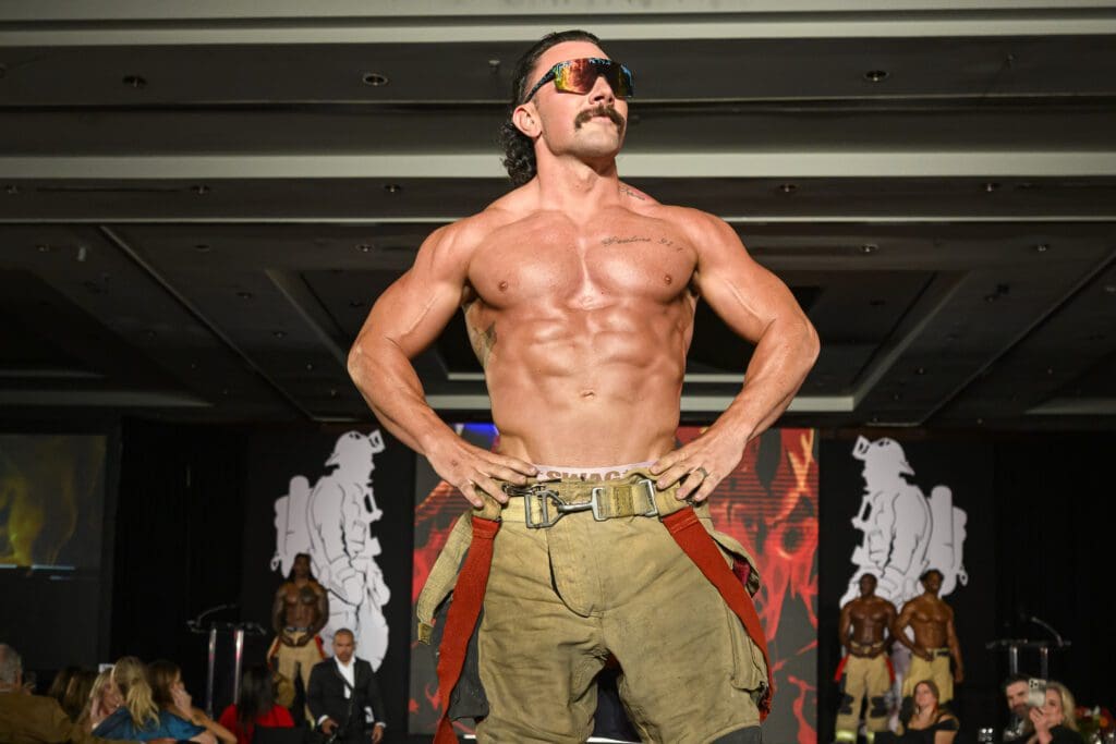 Fire Fighter Calendar model Daniel, Mr. April, strikes a pose at the Houston Fire Fighters ‘Red Hot Gala’ (Photo by Catch Light Group)