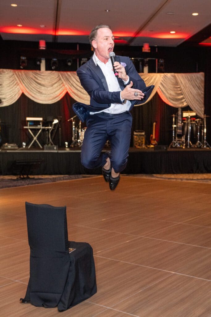 Jumpin' Johnny Bravo leading the live auction at the Ronald McDonald House Charities 'Boo Ball' (Photo by Jacob Powers)