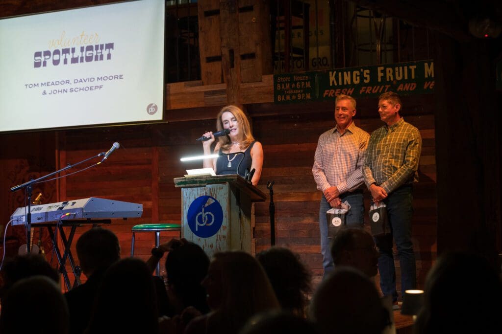 Dr. Amy Wood thanked volunteers John Schoepf, David Moore and Tom Meador during "A Night in Nashville'" celebration at Dosey Doe. (Photo courtesy of Project Beacon)