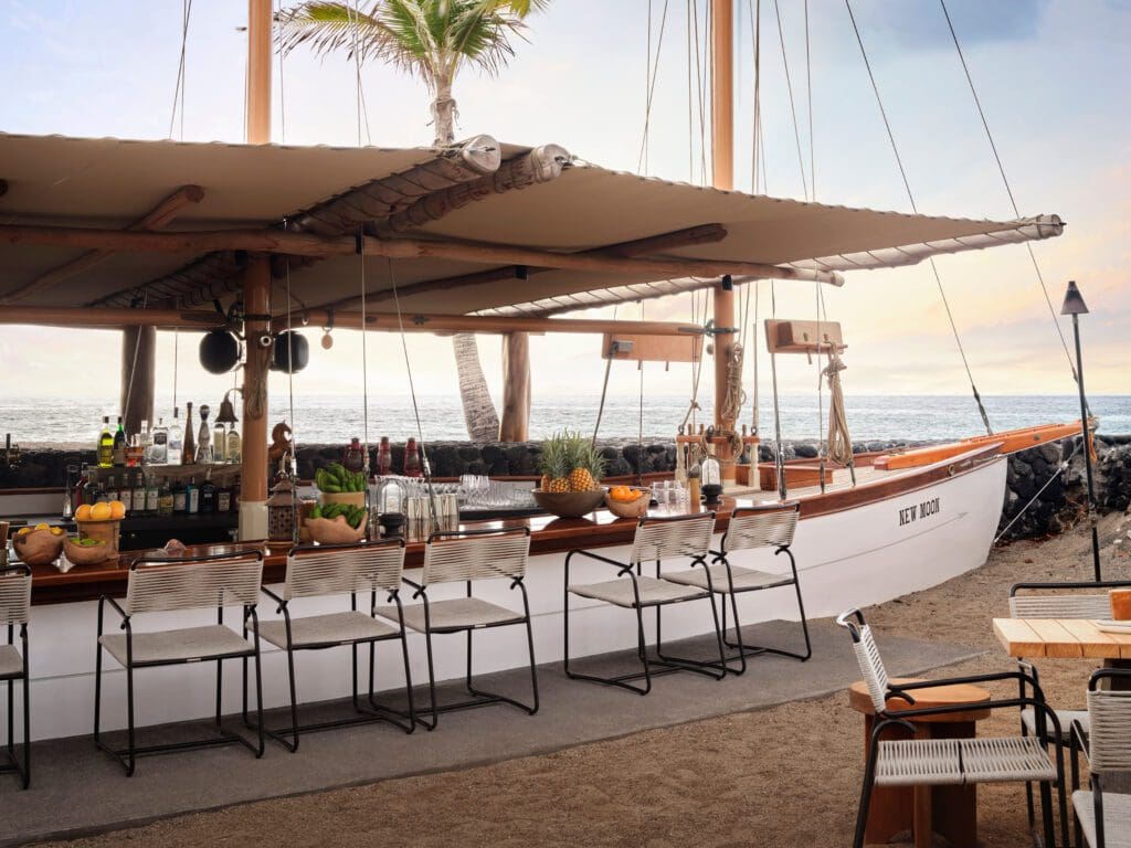 Kona Village restored the beloved schooner of the resort's founder, Johnno Jackson, and quite literally turned it into a bar that serves Maki rolls, Nigiri, and sashimi. (Photo by Kona Village, A Rosewood Resort)