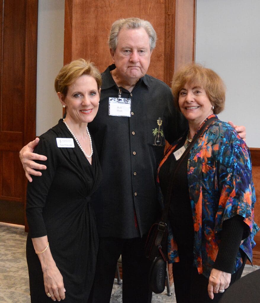 Young Texas Artists President/CEO Susie Moore Pokorski with Bob Hurt and Kathryn Lane of The Woodlands. Lane, an author, is the creator of the popular Nikki Garcia thriller series. (Photo by David Hopper)

