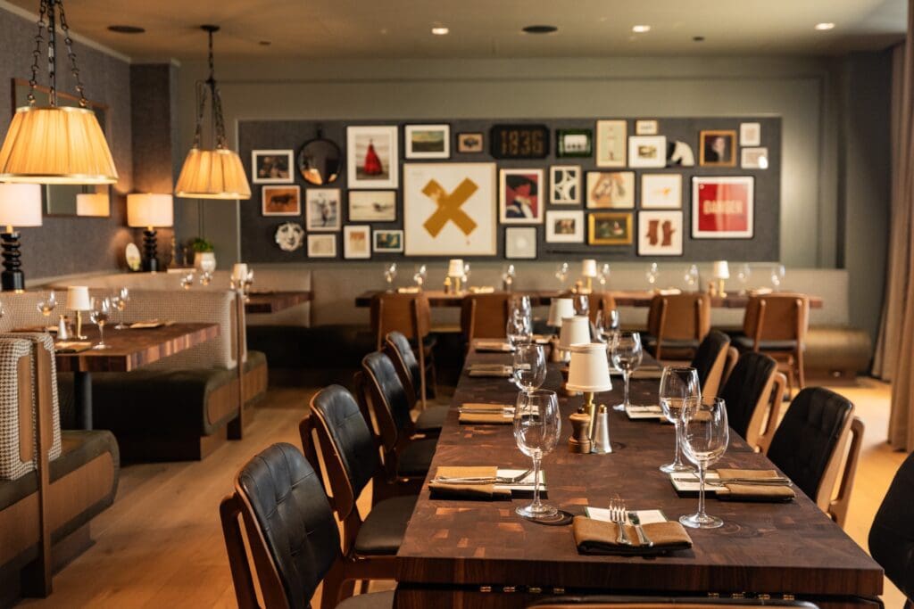 Open for breakfast, lunch, dinner, and weekend brunch, enter the 6,725 square foot eatery beneath the happy evergreen and white striped awnings, or on a perfect fall day, elect to sit out-of-doors, shaded under umbrella-covered tables on the patio. (Photo by Kathy Tran)