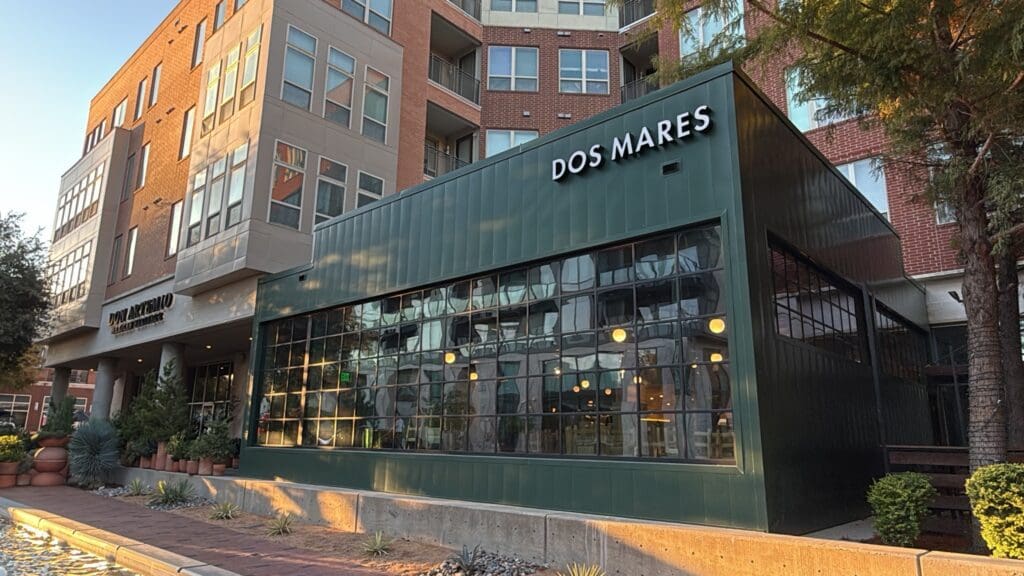 Dos Mares, which is designed by Luis González de León and Javier Lucio, features an open kitchen, overhead wooden beams backed by fishing nets, and teal tiles. (Courtesy)