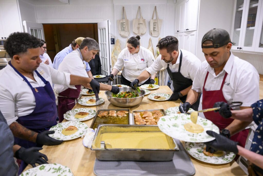 Chef Dominick Lee, Chef Ryan Pera, Chef Sebastian Laval working the 20th anniversary Delicious Alchemy banquet benefiting Recipe for Success Foundation (Photo by CatchLight Group)