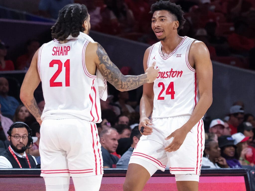 University of Houston veteran guard Emanuel Sharp appreciates Chase McCarty's excitement. (Photo by F. Carter Smith)