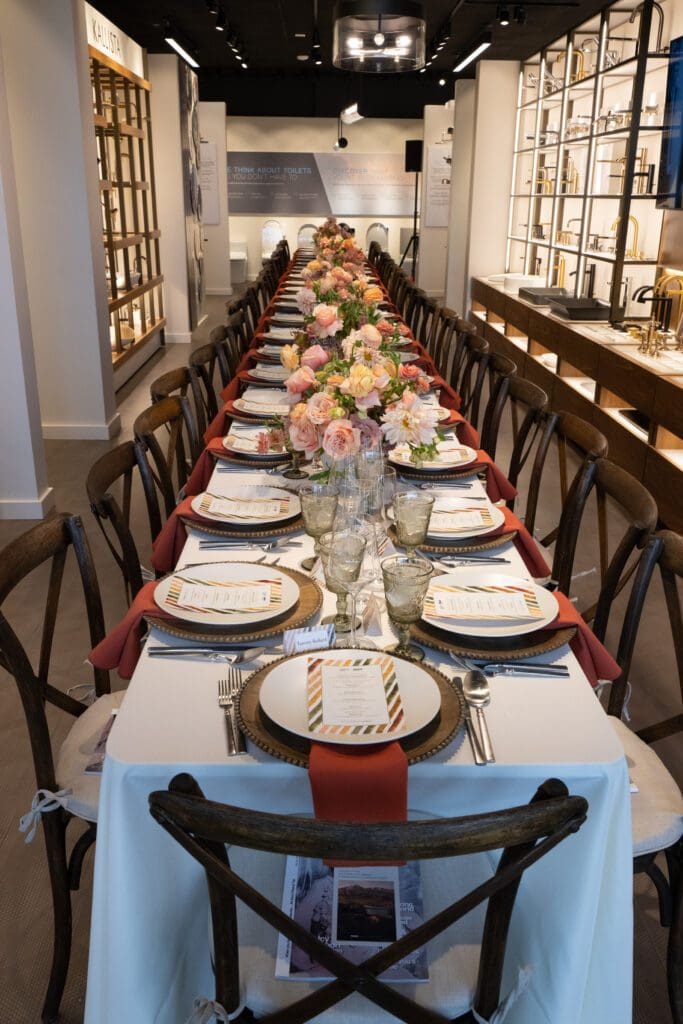 You know a space is gorgeous when you can host a stunning luncheon down the middle of the showroom (quite literally between the sinks!) (Photo by George Fiala)