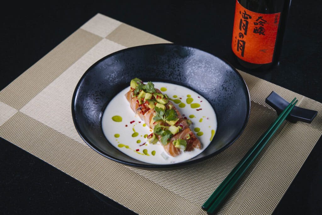 The Salmon Crudo at Nikuya features yuzu leche de tigre, jalapeño, cucumber, avocado, and chili. (Courtesy of Nikuya)