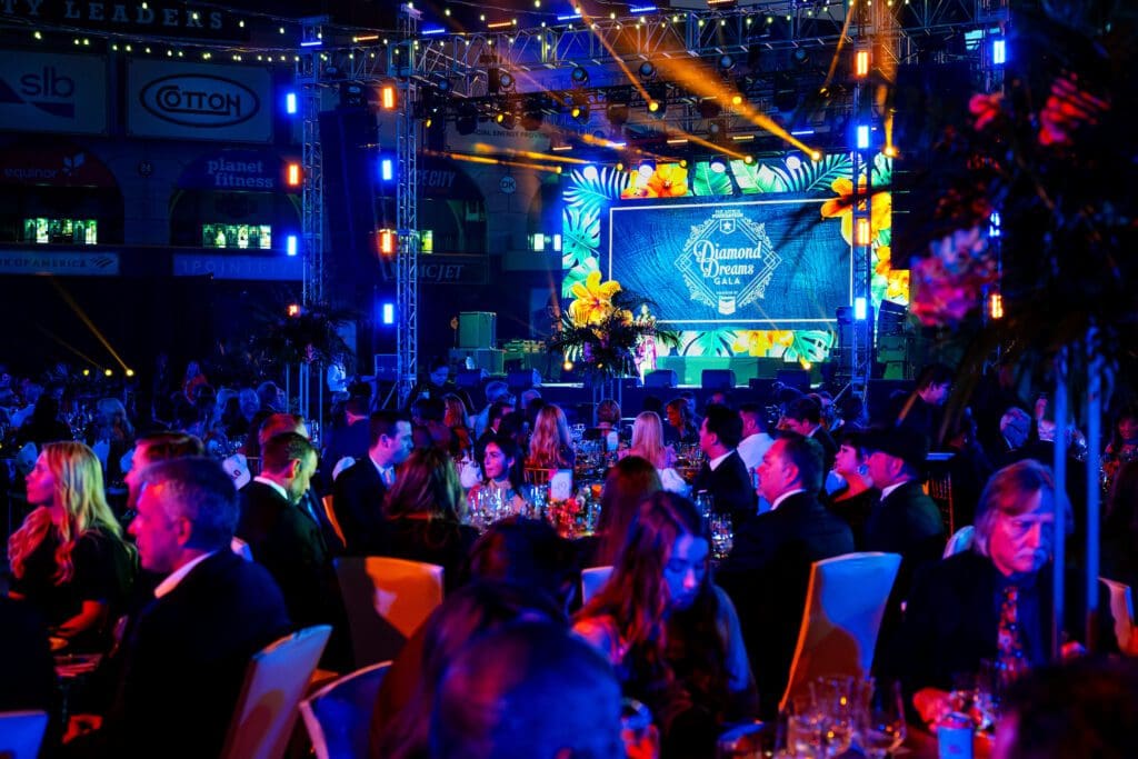 Tables are set and dinner is served on the field at Daikin Park during 'Diamond Dreams' gala (Photo courtesy of Houston Astros)