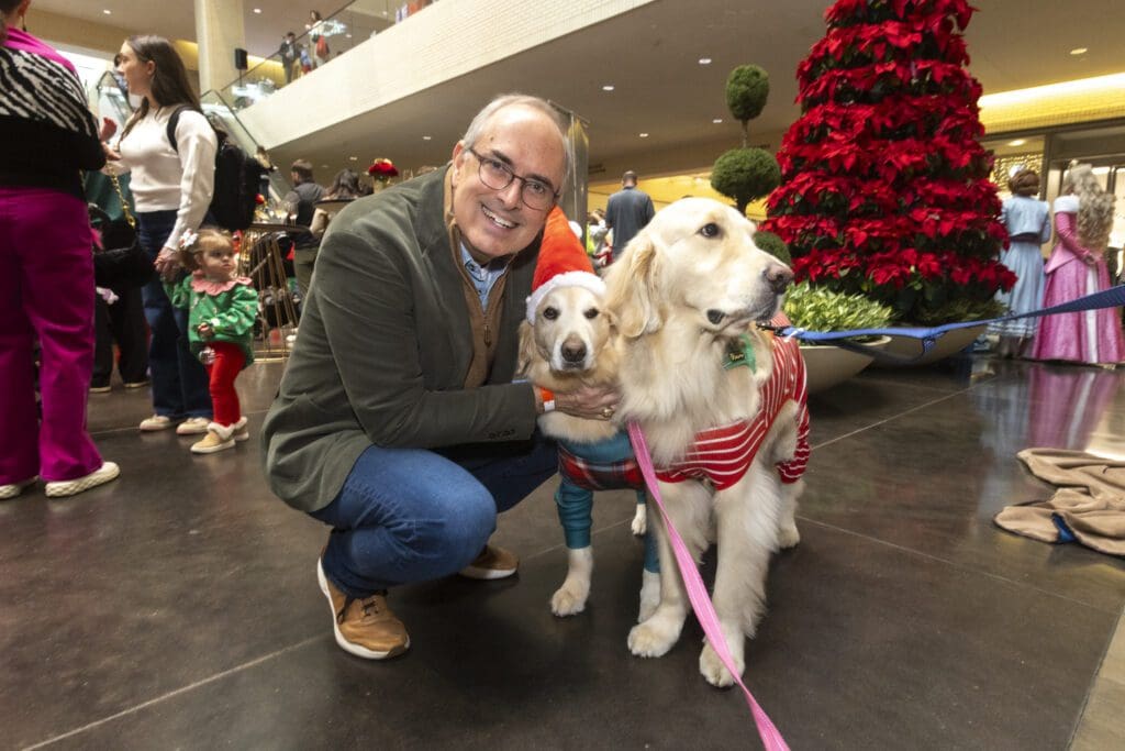 Brent Christopher with Children’s Pet Therapy dogs Rex and Caramel (Photo by Kim Gleason)