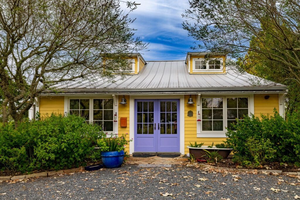 The charming color palette on the cottage at 3100 Trails End in Brenham (Photo by Courtesy of Nan & Company Properties)