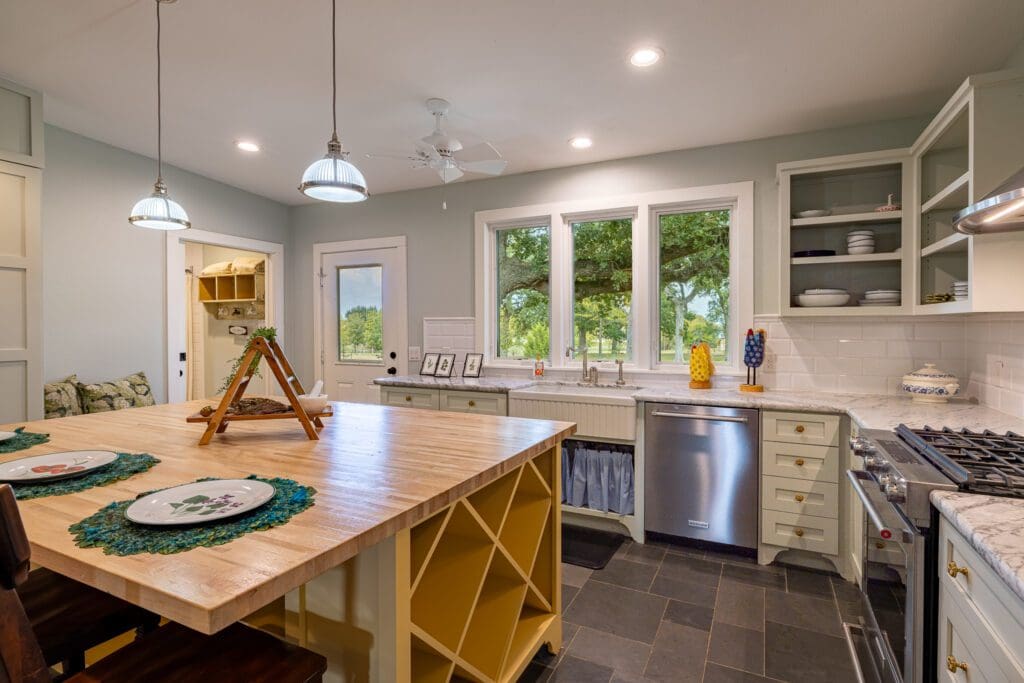 The country kitchen with modern amenities at 3100 Trail's End in Brenham  (Photo by Courtesy of Nan & Company Properties)