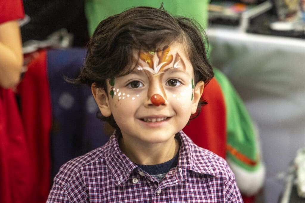 Breakfast with Santa Spectacular always includes holiday face painting. (Photo by Kim Gleason)