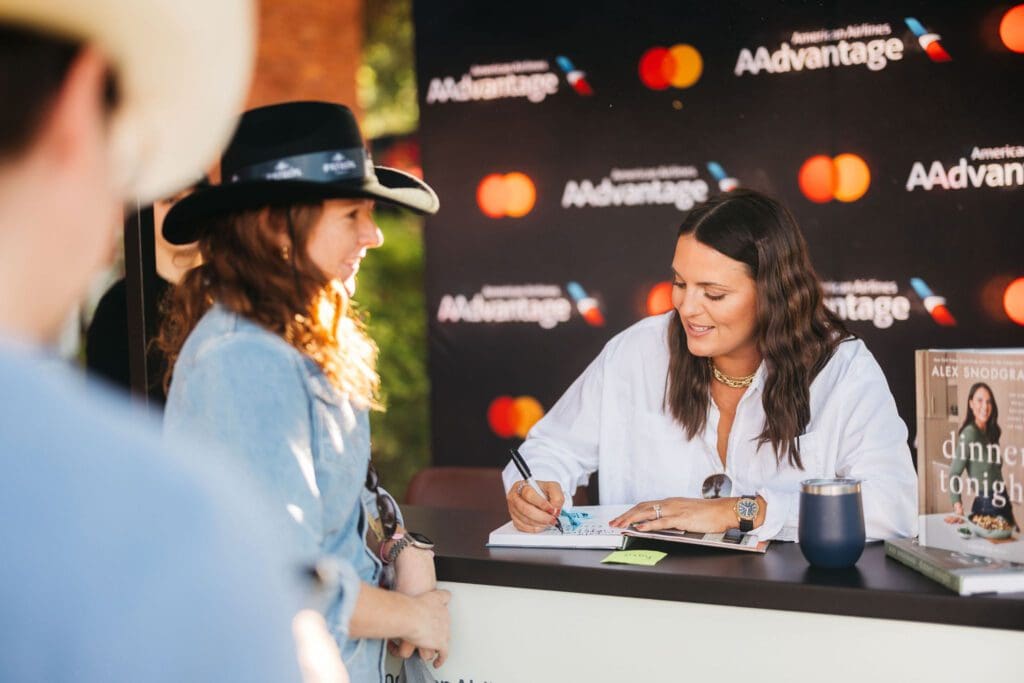 The Defined Dish's Alex Snodgrass signed books at Chefs for Farmers. (Photo by Chase Hall)