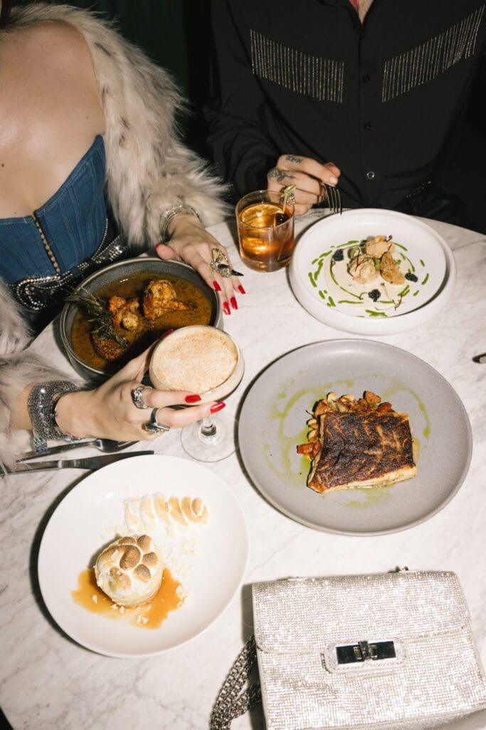 Choose from a Gulf Coast–inspired à la carte menu or a festive four-course prix-fixe NYE menu with a champagne toast at Commons Club.
