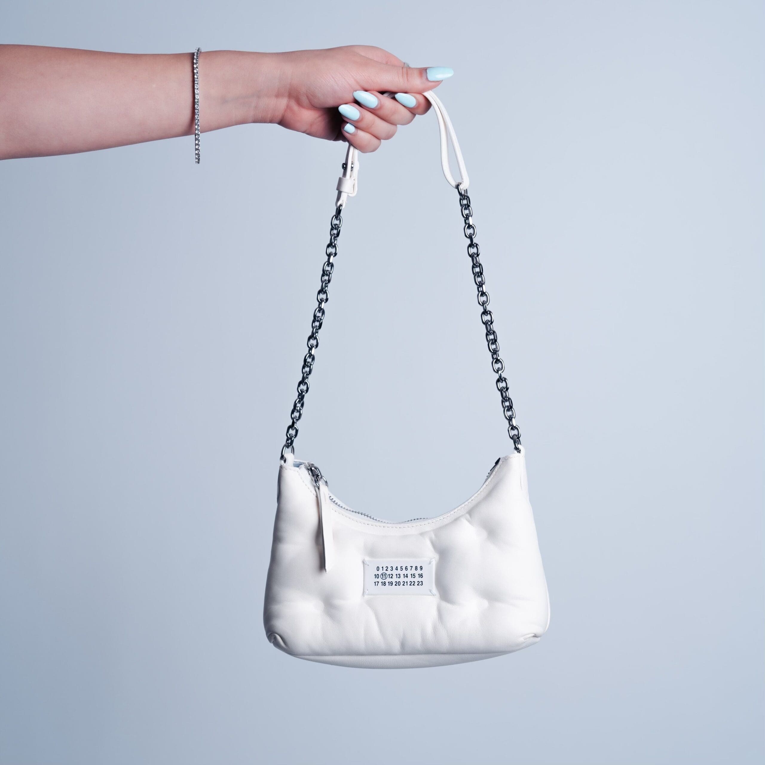 Purse Score: Maison Margiela Glam Slam Hobo Micro bag in white nappa leather with a chain strap, sold at 2nd Street USA.
