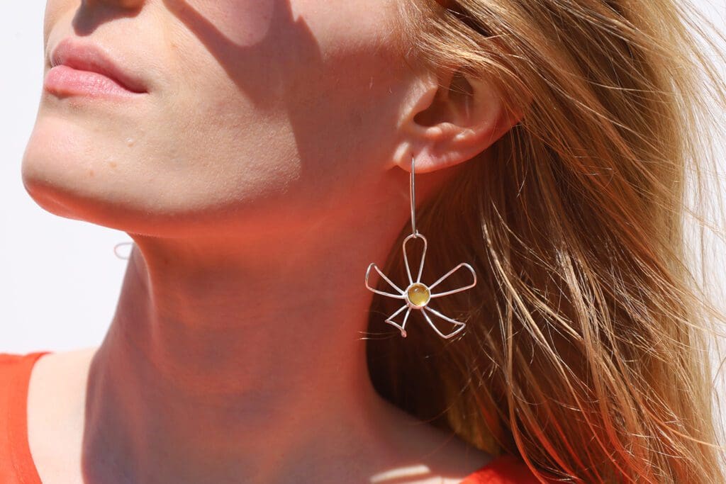 The Flower Girl earrings that bloom from warm, gold-colored stones. (Courtesy)